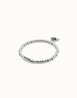 Pulsera UNO DE 50 elástica corazón y cristal negro.